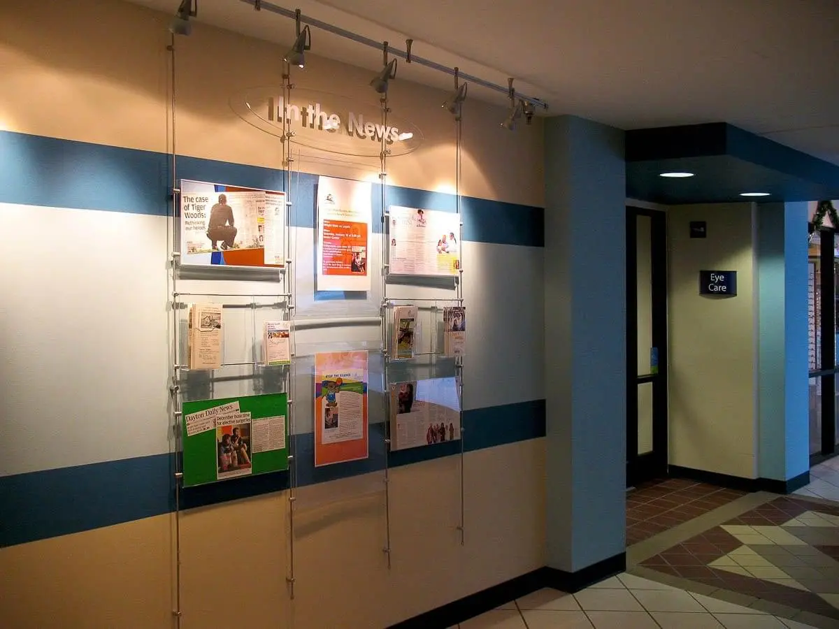 R1003 — Information Display with Acrylic Info/Poster Frames and Literature Holders / Rod Suspended